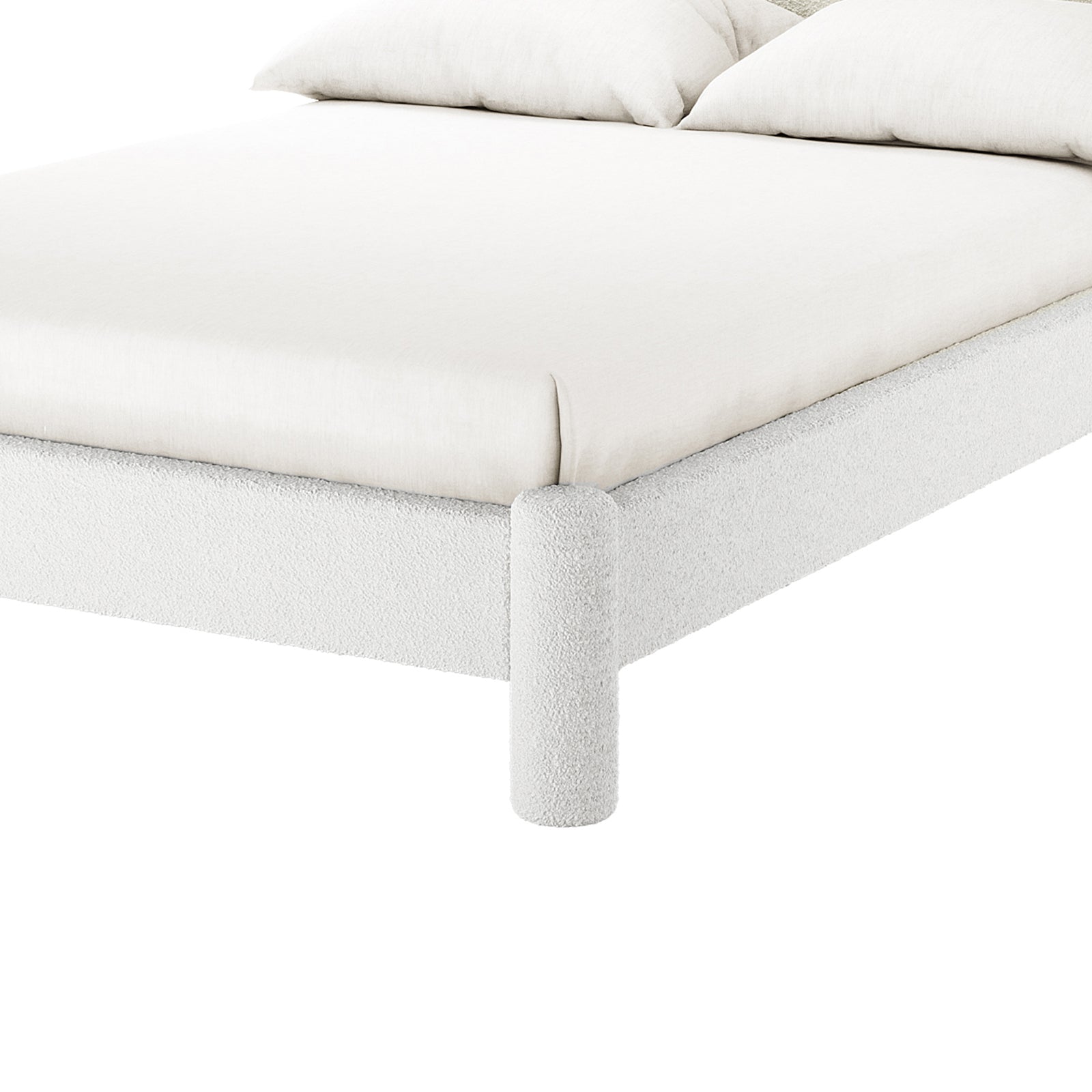 Close-up of the Rhoda Double Boucle Fabric Bed Frame in Cream White, showcasing its textured, rounded fabric frame and cylindrical leg, with a light-colored mattress and pillows visible.