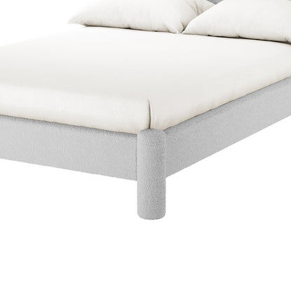 Rhoda Double Boucle Fabric Bed Frame in Light Grey, featuring a low-profile design with a soft-fabric frame, cylindrical legs, and an oversized curved headboard for modern comfort and style.