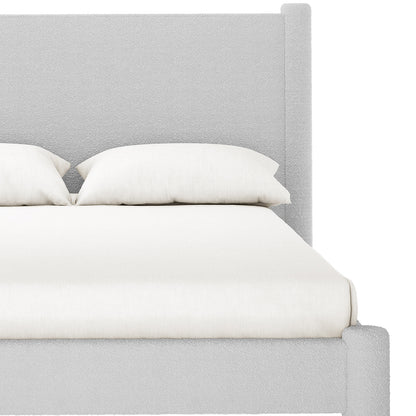 Front view of Rhoda Double Boucle Fabric Bed Frame in Light Grey, featuring a tall, straight headboard and low-profile frame in pale boucle fabric, with a white mattress and pillows.
