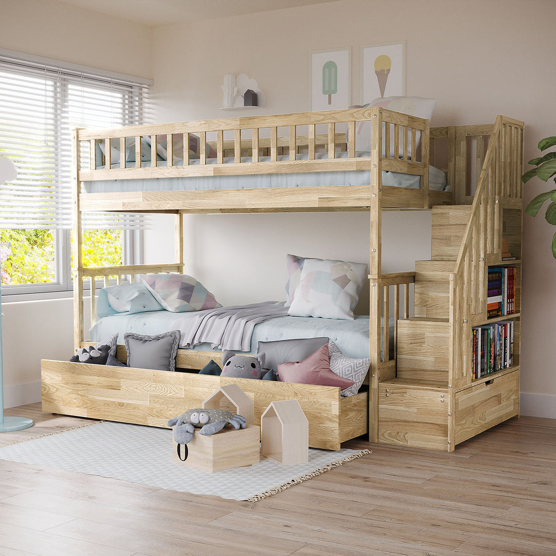 Sabbie Hardwood Single Storage Bunk Bed in Natural features a light wood finish, staircase with bookshelf, pull-out drawers, pastel bedding, geometric pillows, and plush toys against a bright, airy room backdrop.