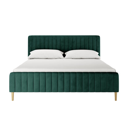 Seneca King Curved Velvet Fabric Bed Frame in Green features a tall, channel-stitched headboard, matching low footboard, and simple wooden legs, all upholstered in luxurious velvet with white bedding.