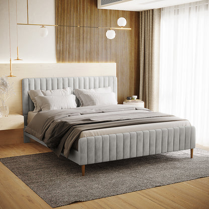 Seneca King Upholstered Velvet Bed – Slate, featuring a soft gray velvet frame with vertical channel tufting on the headboard and footboard, set in a minimalist bedroom with modern decor elements.