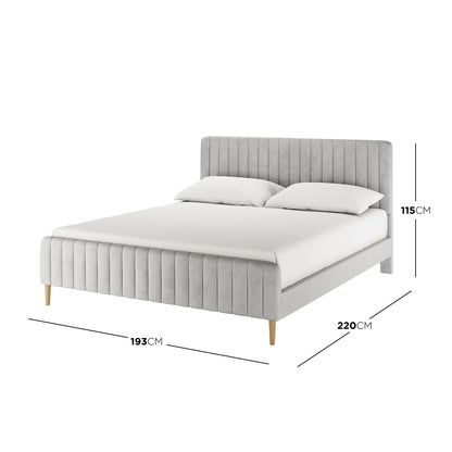 Seneca King Upholstered Velvet Bed – Slate, queen-size with light grey vertically channel-tufted headboard, footboard, and four tapered wooden legs. Dimensions: 220cm depth, 193cm width, 115cm height.