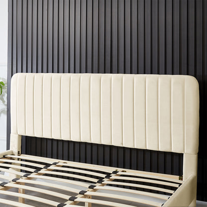 Seneca King Upholstered Velvet Bed – Sandy White features a tall, cream-colored headboard with vertical channeling and visible plywood slats, showcasing its elegant design against a dark ribbed wall.