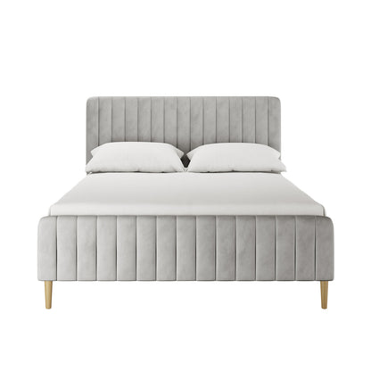 Seneca Queen Upholstered Velvet Bed – Slate; features a vertically channeled, padded headboard, matching footboard in light gray fabric, white sheet and pillows, and four tapered wooden legs.