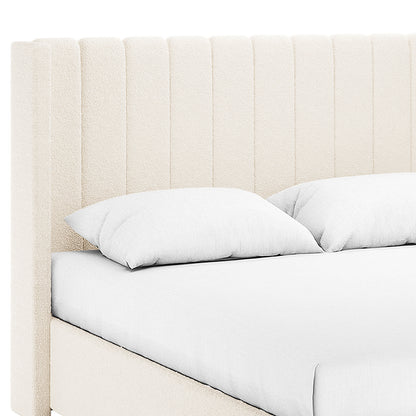 Septima & Fulvia Boucle King Bed Base & Winged Headboard in Cream White features a vertically-channeled, padded headboard and matching textured bed frame, with two white pillows atop the mattress.