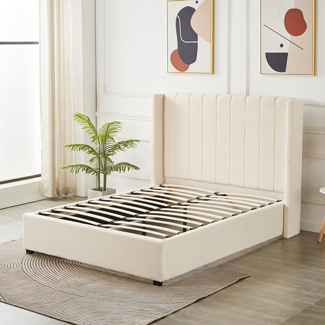 Septima & Fulvia Bouclé Queen Bed Base & Headboard in Cream White, featuring a tall, channel-tufted design with exposed wooden slats, accompanied by mid-century wall prints and a potted palm.