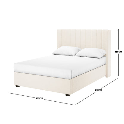 Septima & Fulvia Bouclé Queen Bed Base & Headboard in Cream White features a vertically-channelled headboard, upholstered in plush bouclé fabric, with a mattress and two pillows on display.