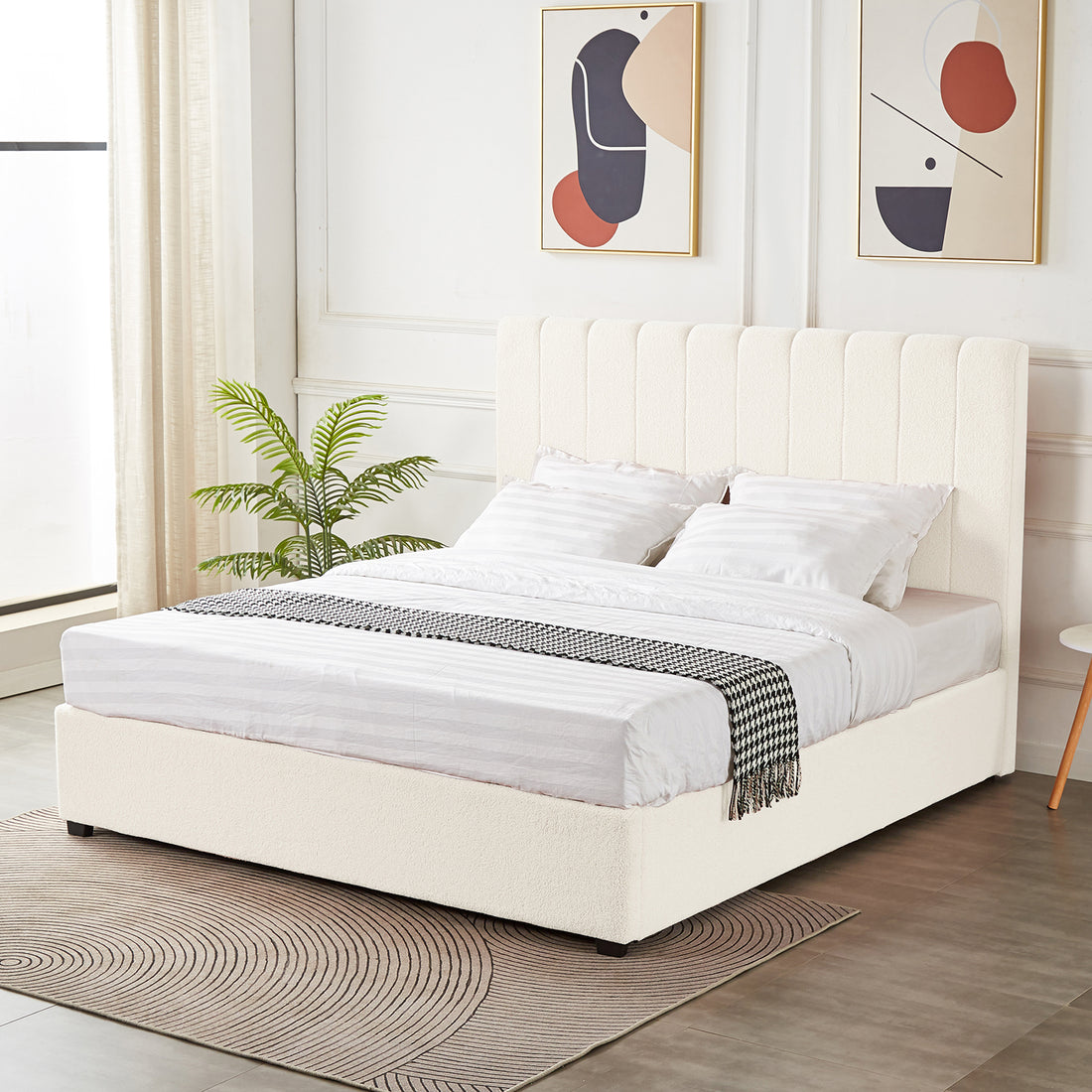 Septima & Gratiana King Bed Base & Headboard in Cream White, featuring a vertically-channeled, upholstered headboard and platform base. Styled with white bedding, houndstooth throw, and modern wall art.