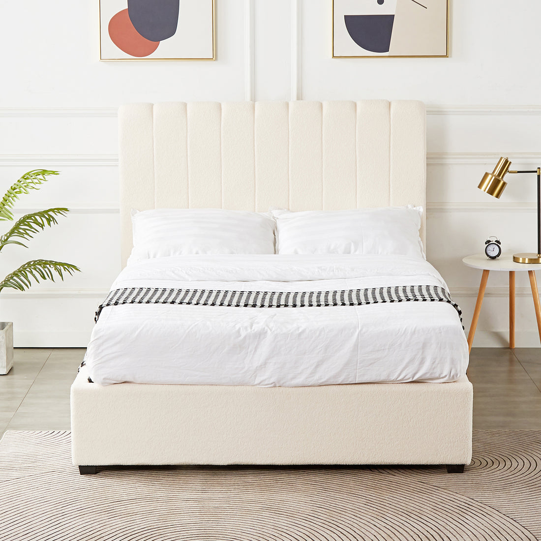 Septima & Gratiana Queen Bed Base & Headboard in Cream White, featuring a channel-stitched headboard, bouclé upholstery, and a wooden frame. Accompanied by a side table, lamp, clock, and geometric art prints.
