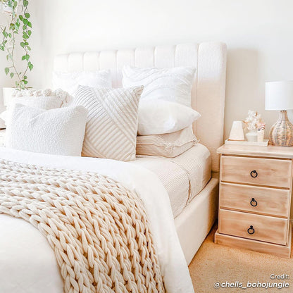 Septima & Gratiana Queen Bed Base & Headboard in Cream White, featuring a channel-tufted bouclé headboard, solid wood frame, and sprung slats, nestled in a cozy, boho-inspired bedroom corner with textured pillows and a knit throw.