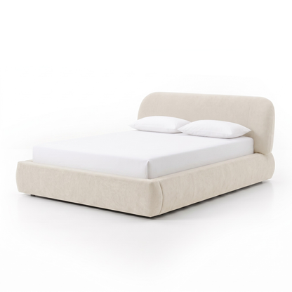 Modern upholstered bed shown fully on a white background with pillows and bedding