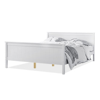 Close-up of Tertia Solid Pine Timber Bed Frame Double, showcasing its solid pine construction and engineered wooden slats, emphasizing durability and support. A person lies on a neatly arranged bed.