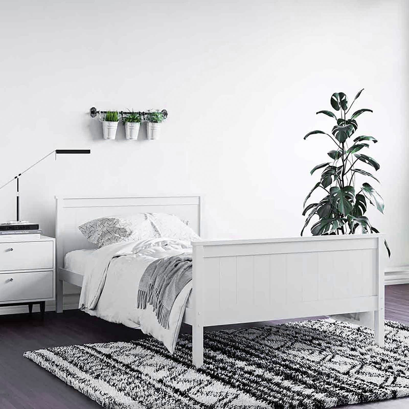 Close-up of the Tertia Solid Pine Timber Bed Frame King Single, showcasing its solid pine construction and sturdy engineered wood slats, highlighting the bed frame's robust design and quality craftsmanship.