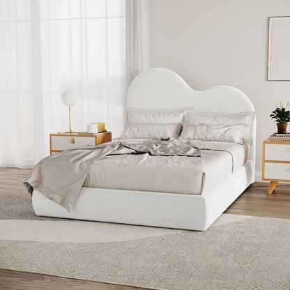 Thales Double Curved Boucle Fabric Bed Frame in Cream White with a cloud-shaped headboard, set in a minimalist bedroom, featuring neutral bedding, wooden bedside tables, and floor-to-ceiling curtains.