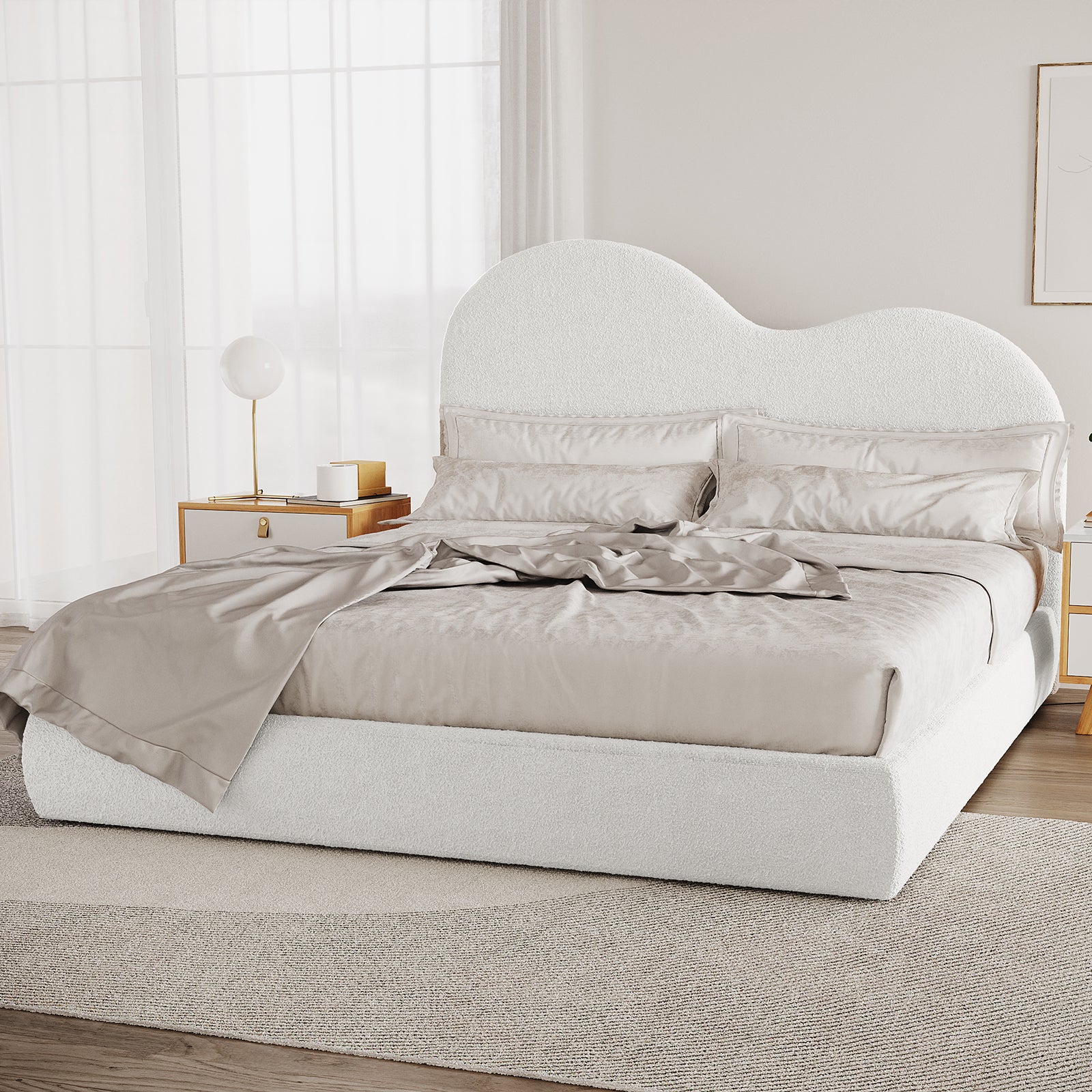 Thales King Curved Boucle Fabric Bed Frame in Cream White features a cloud-like headboard, neutral-tone bedding, light wood nightstands, globe lamp, and sheer curtains, creating a modern, serene bedroom scene.