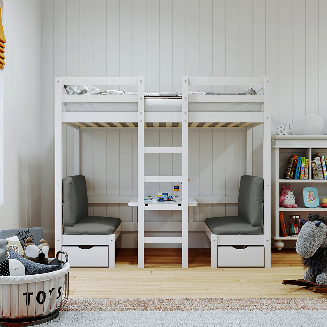 Children’s room corner featuring the Timothy Solid Pine Loft Bed with Desk in Grey, showcasing a white frame with ladder, integrated desk, benches with storage, and surrounding toys and books.