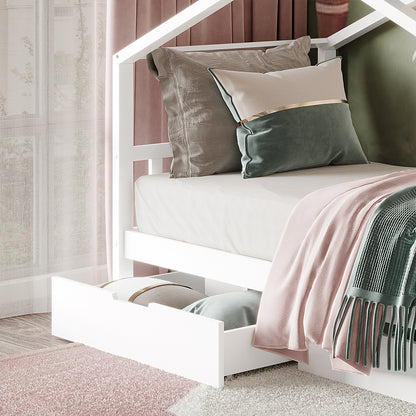 Tucker Solid Pine Timber Kids Bed with Drawers White features a house-frame design, pastel linens, decorative pillows, and storage drawers below, creating a cozy and functional sleeping space for children.