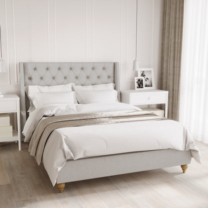 Vilania Tufted Fabric Bed Frame - Double - Grey with a plush tufted headboard, solid wood frame, and low-profile design, displayed with bedding and pillows, emphasizing its modern elegance and functionality.