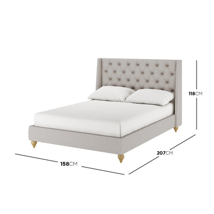 Vilania Tufted Fabric Bed Frame - Double - Grey displayed on a bed, emphasizing its elegant tufted headboard and sturdy construction, with a white pillow placed on the bed for visual context.