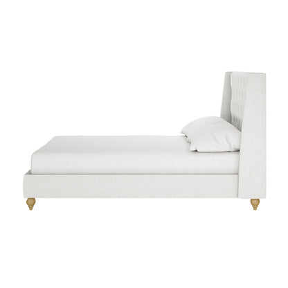 Vilania Tufted Fabric Bed Frame - Double, showcasing a side view with an off-white tufted headboard, low platform base, two matching pillows, and small wooden legs, emphasizing elegance and comfort.