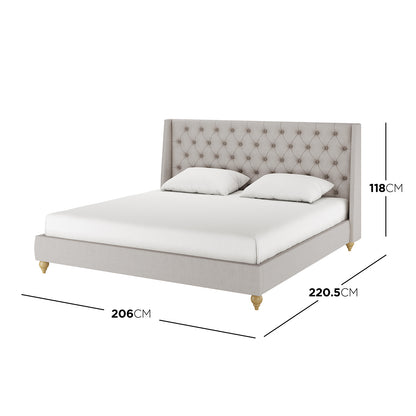Vilania Tufted Fabric Bed Frame - King - Grey, showcasing an elegant tufted headboard and solid wood frame, is displayed with a white pillow on a bed, emphasizing its luxurious design and craftsmanship.