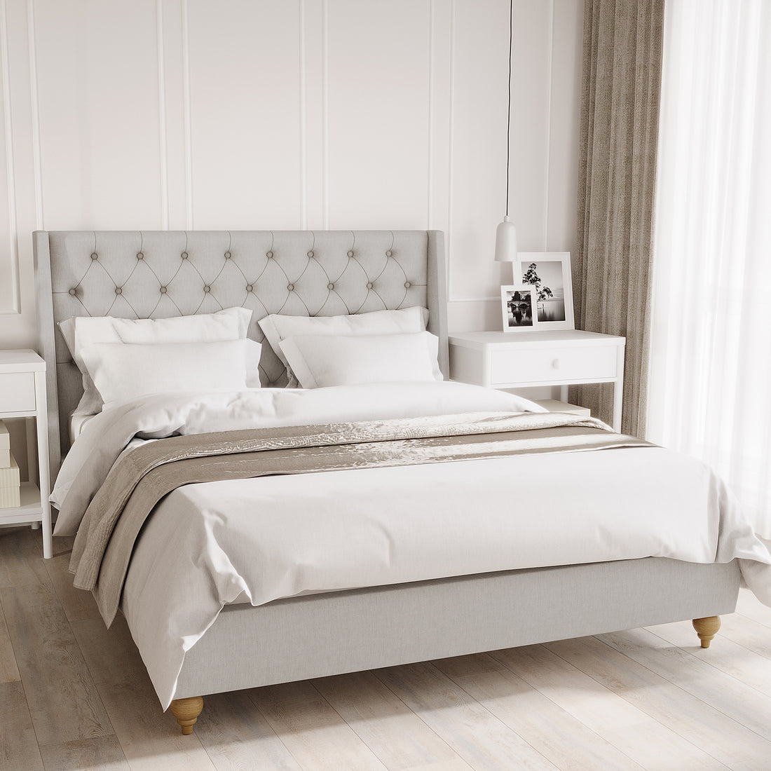 Vilania Tufted Fabric Bed Frame - Queen - Grey, displayed in a bedroom setting with a plush tufted headboard, showcasing its elegant design and solid wood construction alongside nearby bedding and linens.