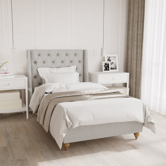 Vilania Tufted Fabric Bed Frame - Single - Grey, featuring a plush tufted headboard and solid wood frame. The image showcases the intricate fabric detailing and sturdy construction, emphasizing its elegance and comfort.