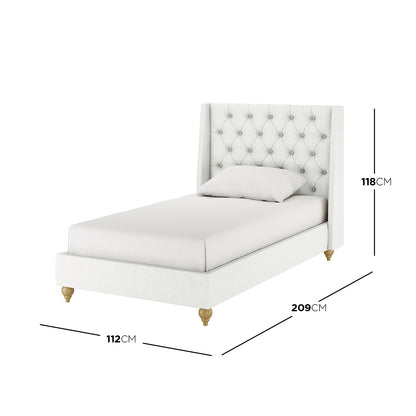 Vilania Tufted Fabric Bed Frame - Single - Off White, featuring a tufted headboard and low-profile design, displayed on a bed with a white pillow, highlighting its elegant and minimalist appeal.