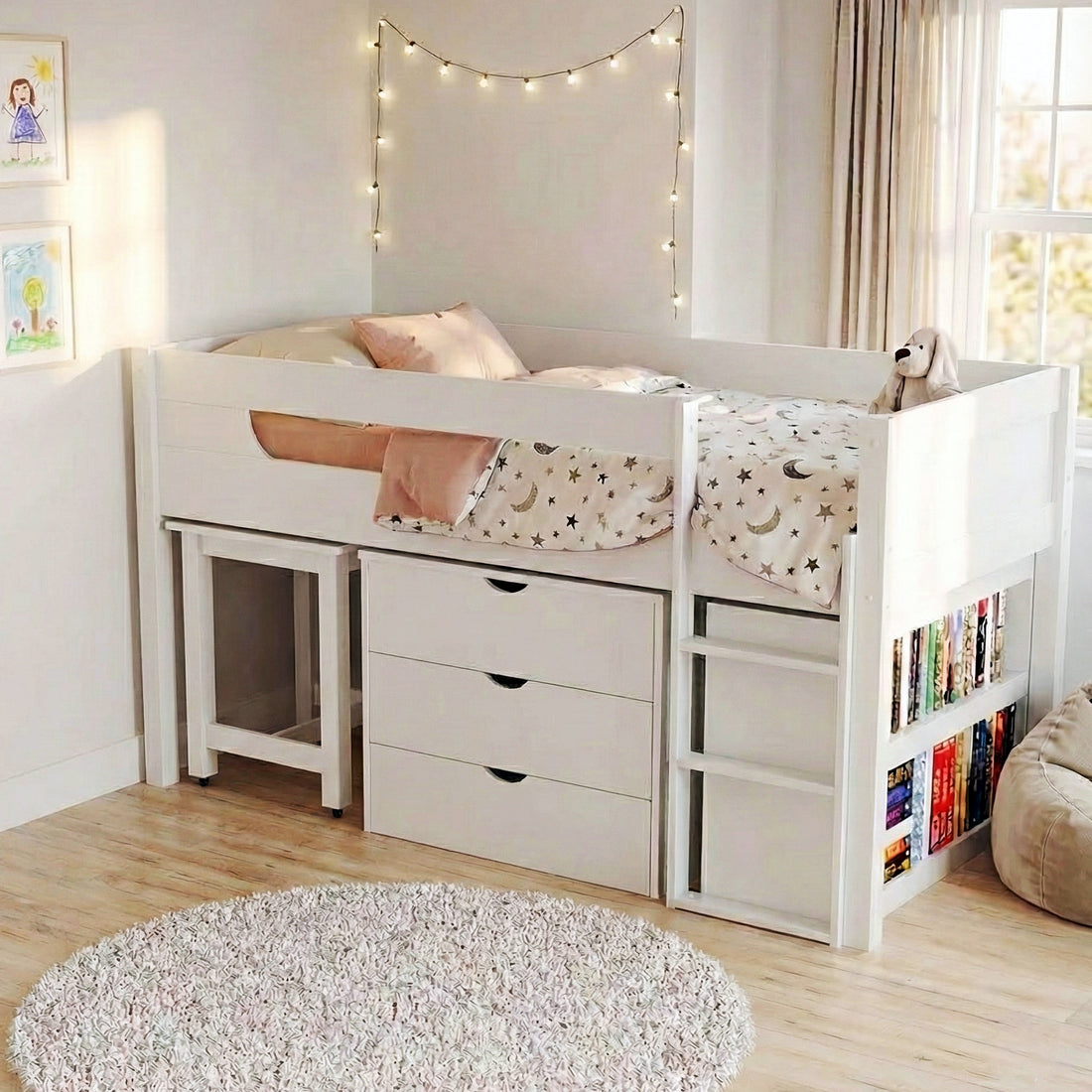 Yuri Solid Pine Storage Loft Bed with Pull Out Desk in White features a high bed, dresser, desk, ladder, star-patterned bedding, book cubbies, fairy lights, shag rug, and beanbag.