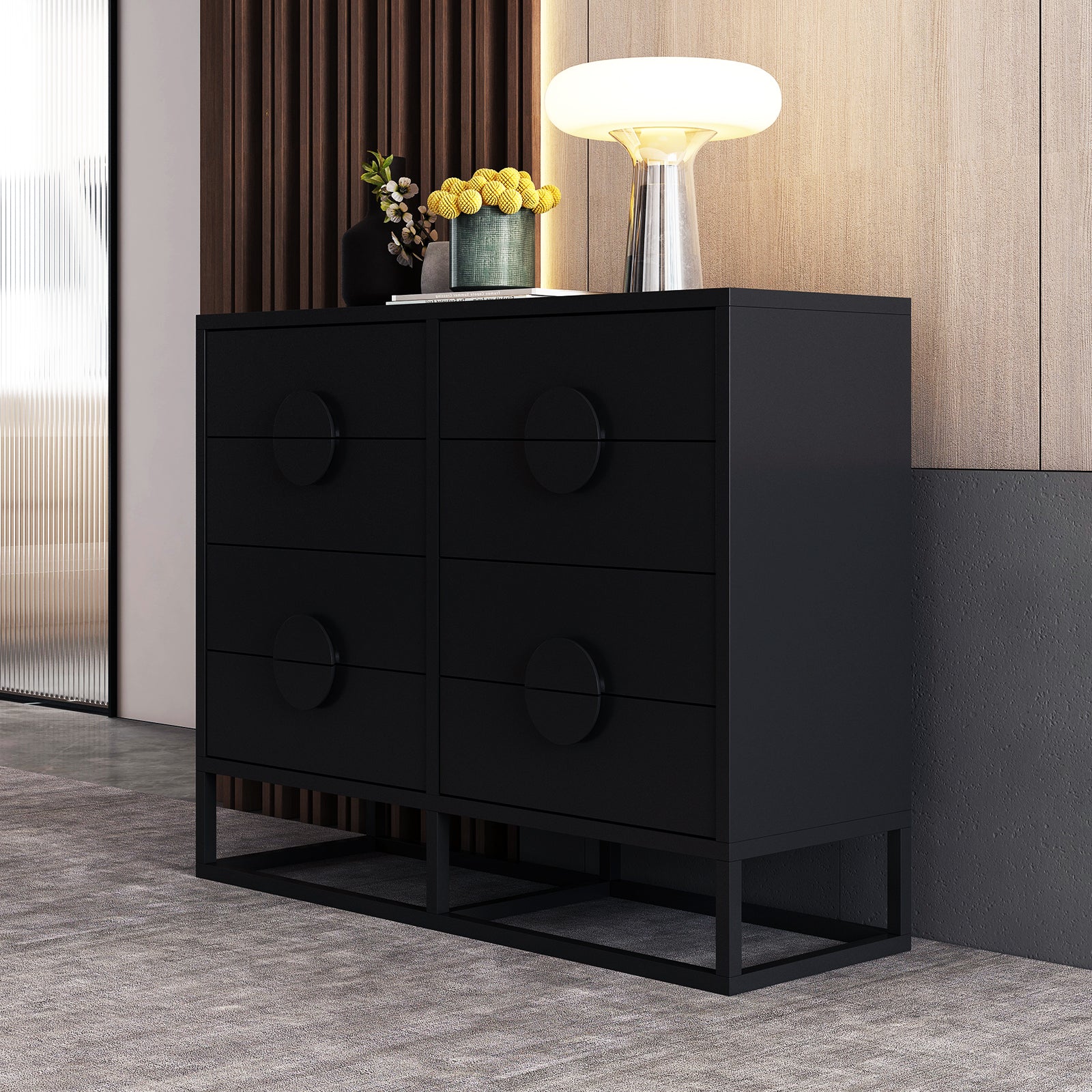 Abigail 120cm Lowboy Dresser with Drawers - Black shown with six drawers, a matte-black finish, and set on an open metal base. Topped with vases and a lamp.