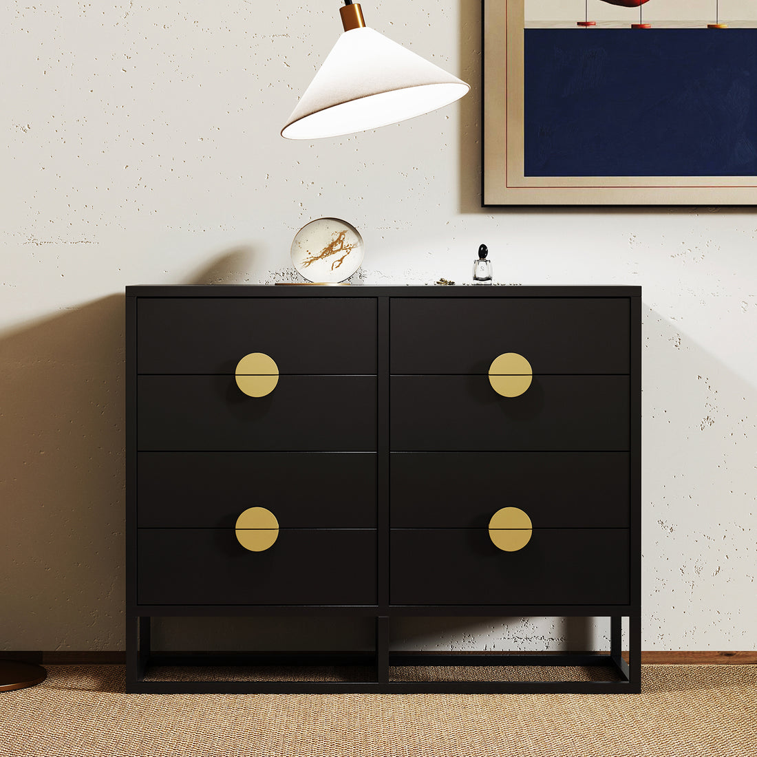 Abigail 120cm Lowboy Dresser with Gold Handle - Black features a sleek black design with six drawers, each adorned with large brass pulls, complemented by a marble-patterned orb and cologne bottle on top.