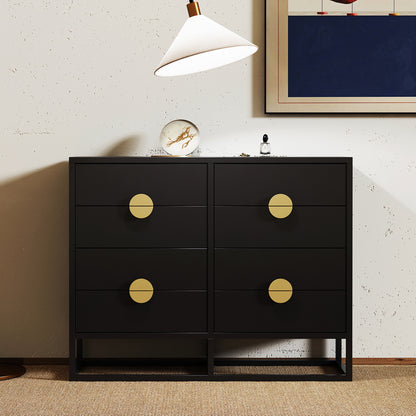 Abigail 120cm Lowboy Dresser with Gold Handle - Black features a sleek black design with six drawers, each adorned with large brass pulls, complemented by a marble-patterned orb and cologne bottle on top.