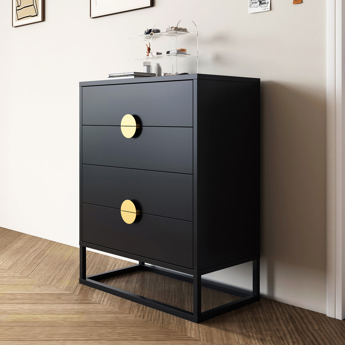 Abigail 76cm Tallboy Dresser with Storage - Blackk features a matte finish, three drawers with oversized brass pulls, and an open-metal base, topped with books and an acrylic organizer.