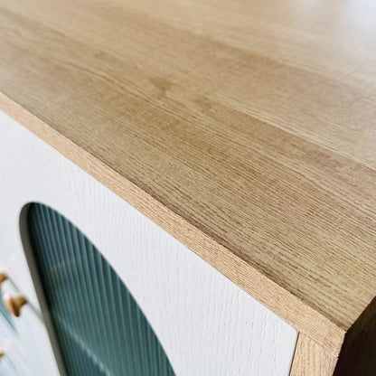 Close-up of the Afra 80cm Buffet Cabinet with Glass Doors in White & Natural, highlighting the light oak-tone top, white painted front, fluted glass inset, and wooden knobs.