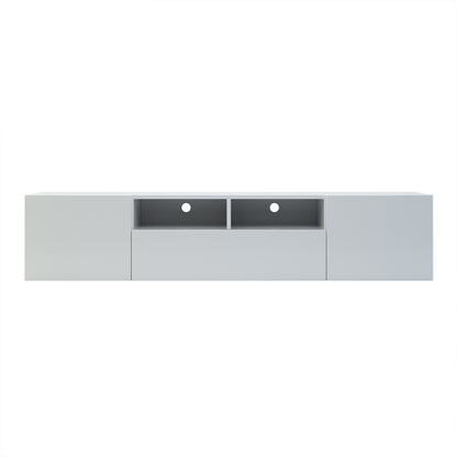 Anton 200cm Entertainment TV Unit in White features a sleek, wall-mounted design with two side cupboard doors, a wide center drawer, and two open cubby shelves, each with cable-management holes.