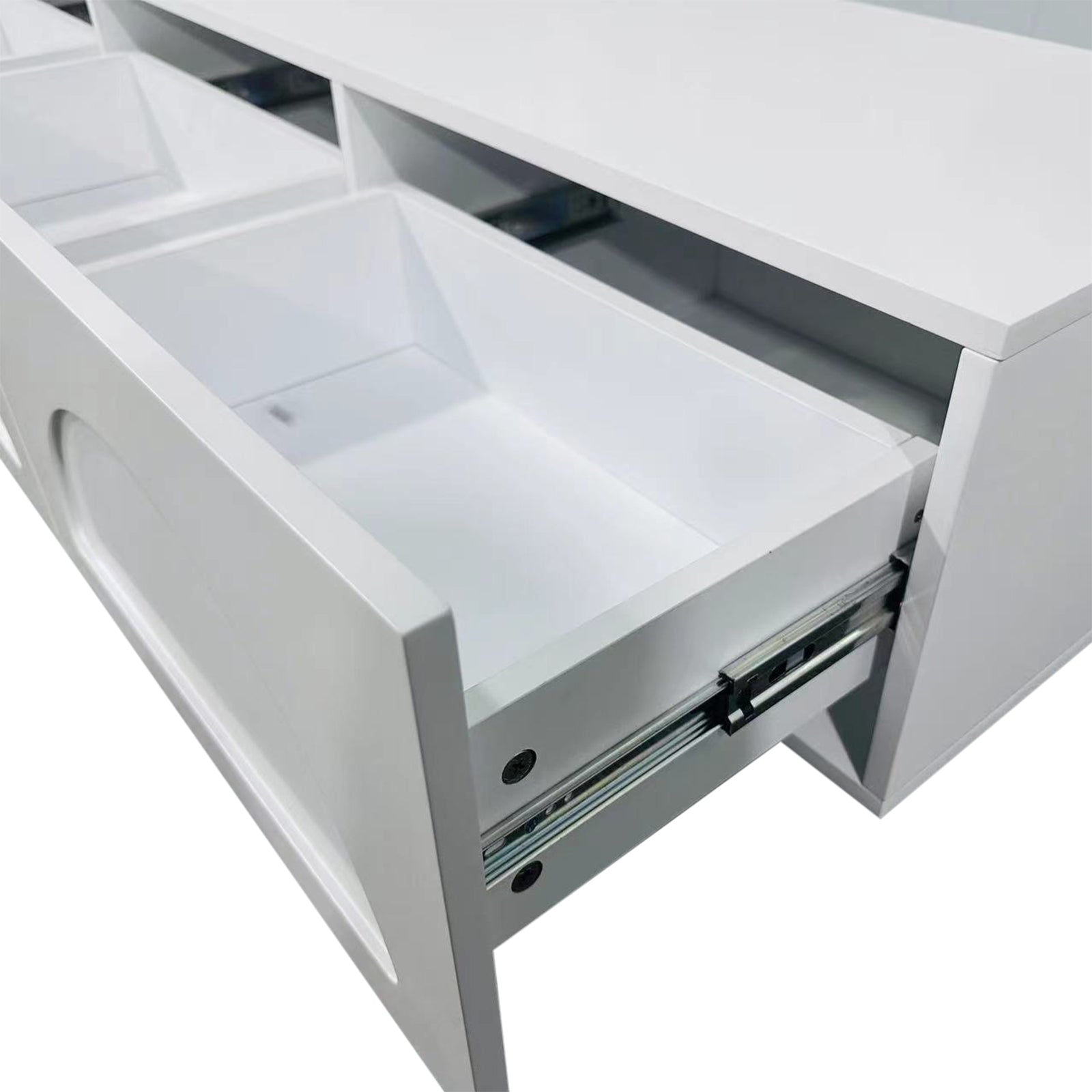 Close-up of the Archen Bedroom & Living Room Storage Package in White, showcasing the modern entertainment unit's sleek design with a drawer partially open on metal runners and two open cubby holes above.