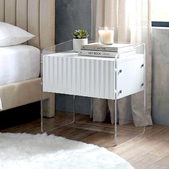 Nightstand beside bed in styled bedroom