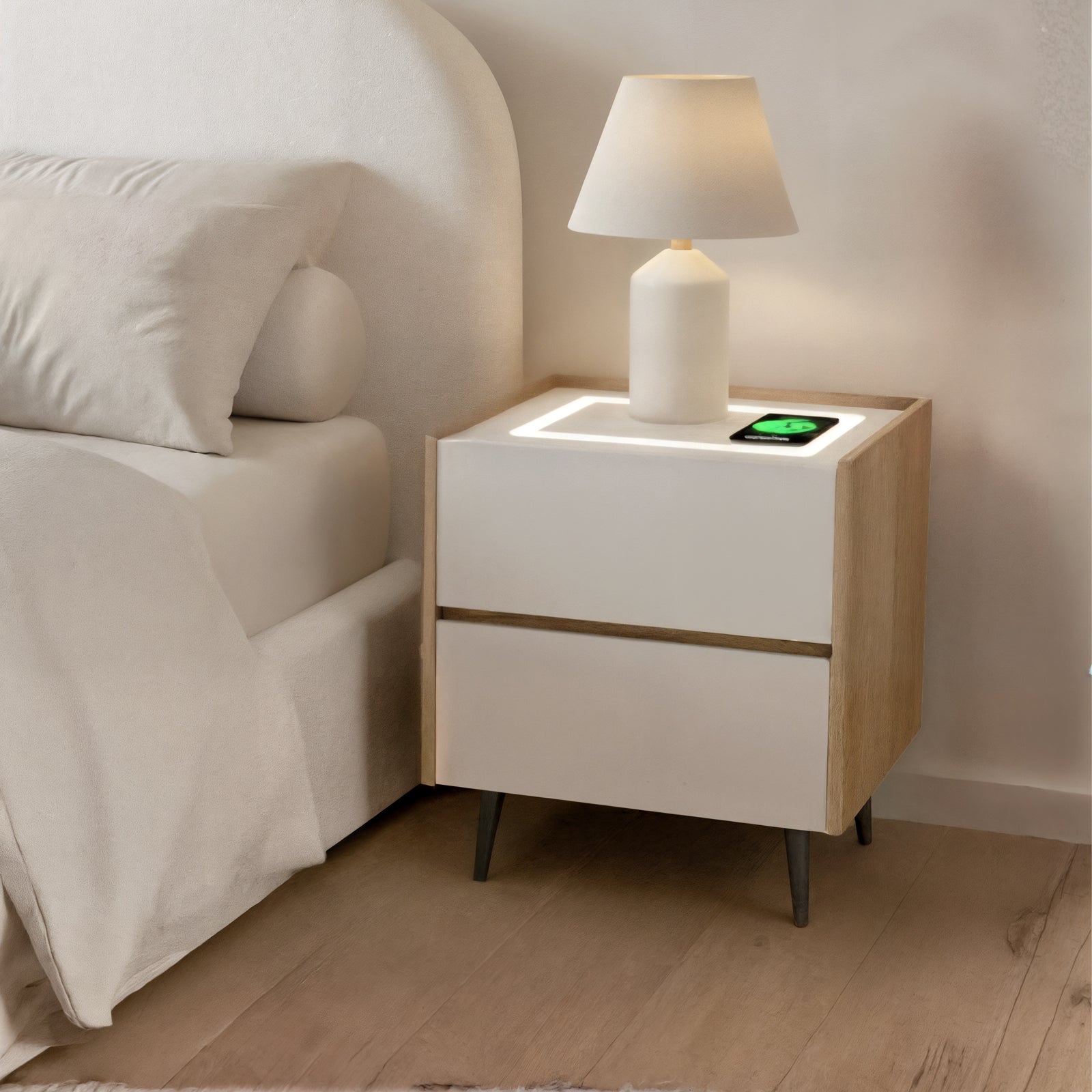 Beth Smart Wireless Bedside Table in White & Natural features a two-drawer design with a sleek table lamp and integrated wireless charger, complementing a minimalist bedroom corner with a modern aesthetic.