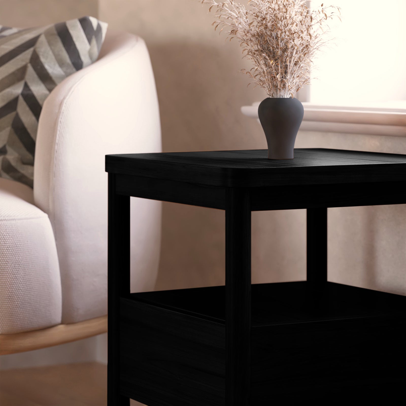 Brett Solid Oak Bedside Table - Black with sleek design, showcasing a white vase on top. Features include a spacious drawer, open shelf, and anti-slip pads for stability.
