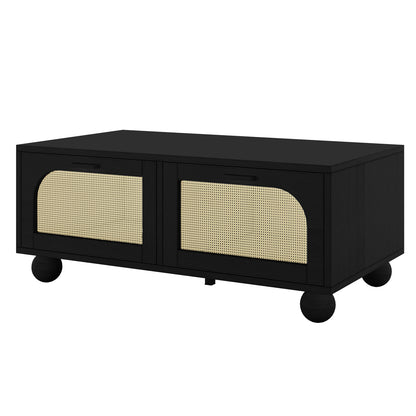 Carlo 110cm Rattan Coffee Table with Storage in Black featuring a matte black finish, arched cane panel doors, and bun feet. Equipped with slim black handles for easy access.