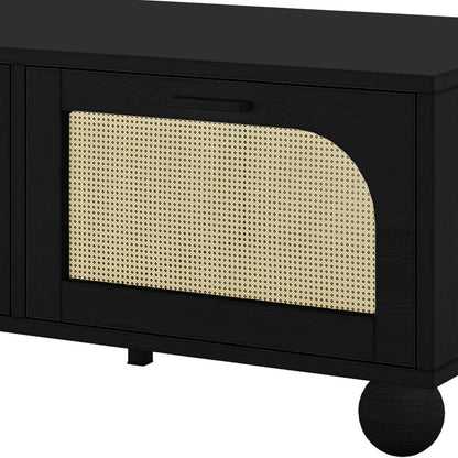 Carlo 110cm Rattan Coffee Table with Storage in Black features a black-stained wood cabinet with arched rattan screen, rectangular handle, and short bun feet, offering stylish storage functionality.