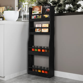 Chastor 100cm Solid Oak Spice Rack Storage - Black in a kitchen corner, holding cookbooks and spice jars on four shelves, alongside a white cabinet and kitchen counter accessories.