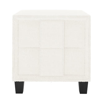 Crossandra Boucle Bedside Table in Cream White, showcasing a cube-shaped design with off-white bouclé fabric in a 3×3 panel grid, on four dark-stained wooden legs, perfect for modern bedrooms.