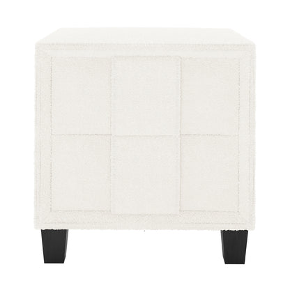 Crossandra Boucle Bedside Table in Cream White, showcasing a cube-shaped design with off-white bouclé fabric in a 3×3 panel grid, on four dark-stained wooden legs, perfect for modern bedrooms.