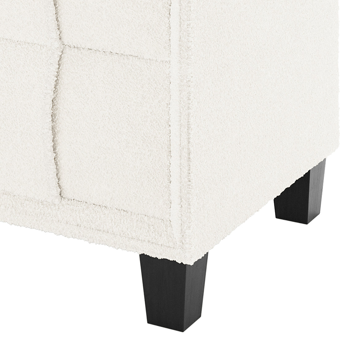 Close-up of the Crossandra Boucle Bedside Table in Cream White, showcasing textured boucle fabric and dark wooden legs, highlighting its elegant and modern design.