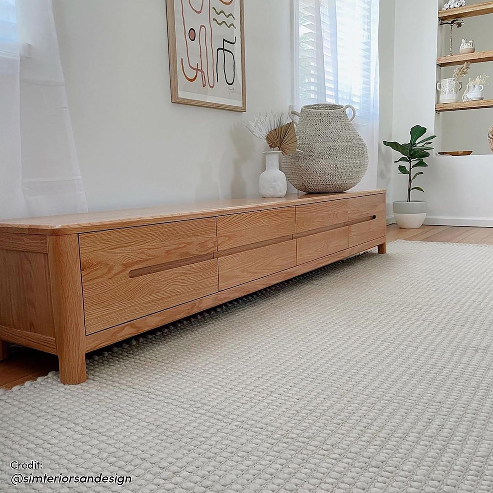 Declan 200cm American Oak Timber Entertainment Unit Natural, featuring a sleek design with four spacious drawers, showcasing its sturdy build and smooth, elegant finish suitable for large TVs.