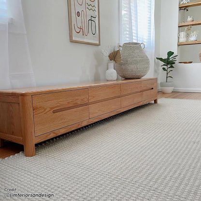 Declan 200cm American Oak Timber Entertainment Unit Natural, featuring a sleek design with four spacious drawers, showcasing its sturdy build and smooth, elegant finish suitable for large TVs.