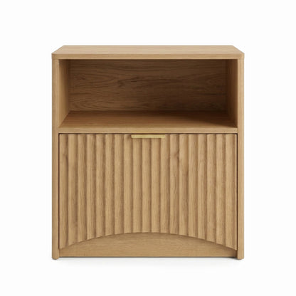 Modern light wood side table with open compartment and textured lower cabinet door on white background.