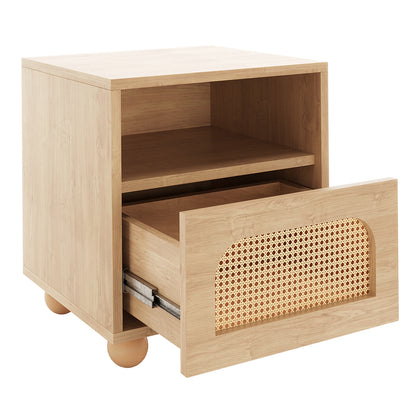 Dialga 45cm Rattan Bedside Table with Storage in Black, featuring a light oak-style veneer, rounded ball feet, open cubby, and a single drawer with a woven cane-panel inset.